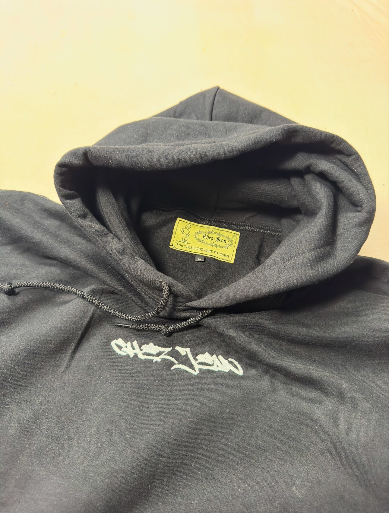 black chez jean writtin logo hoody